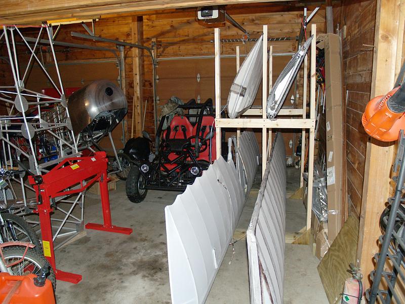 01.jpg - Wing rack and fuselage in the garage.