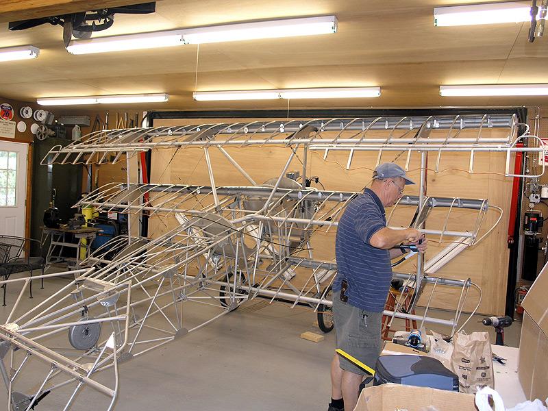 triplaneprogress2.jpg - Robert Rusho working on sheet metal.